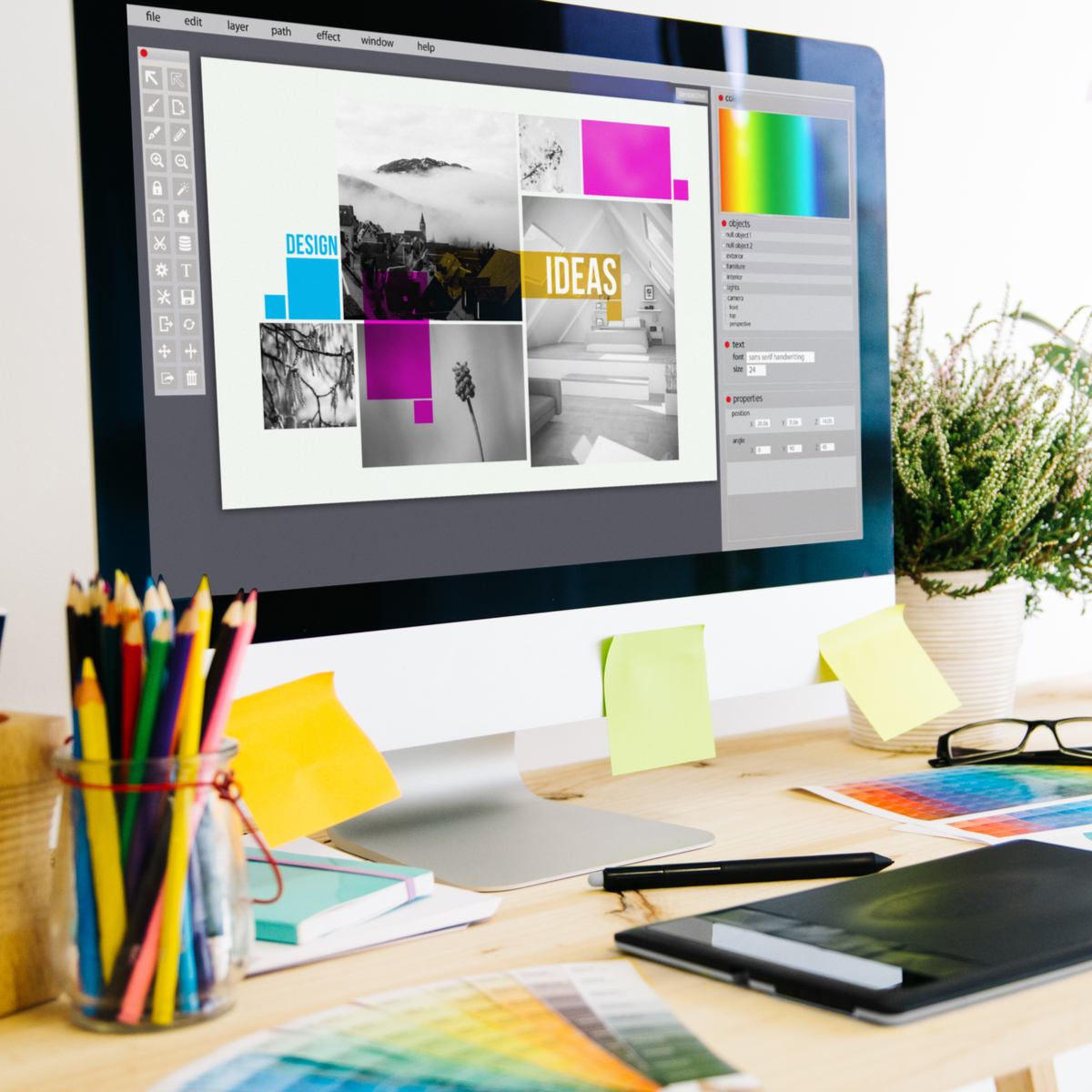 Graphic designer's desk as they plan new visuals for Houston digital marketing strategy