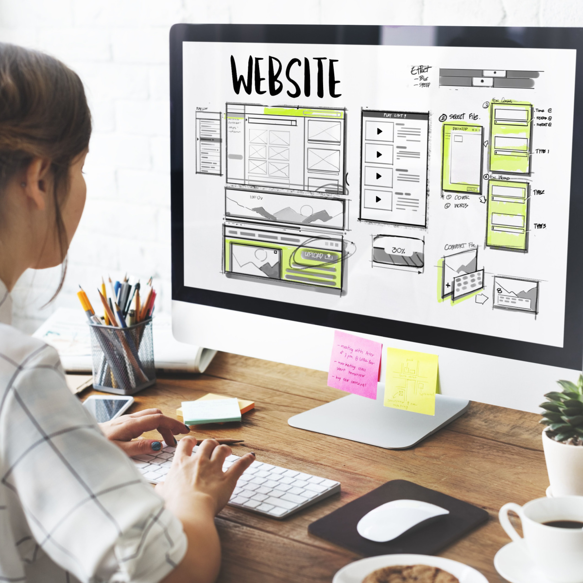 A Houston marketing agency designer performing Houston web design to implement a client's Houston digital marketing strategy.