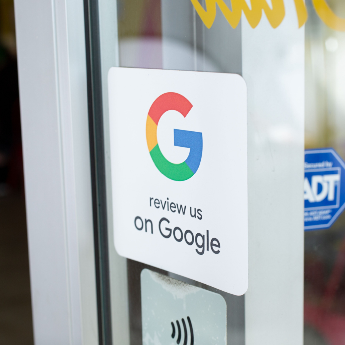 Sign encourages customer to review Houston business on google.