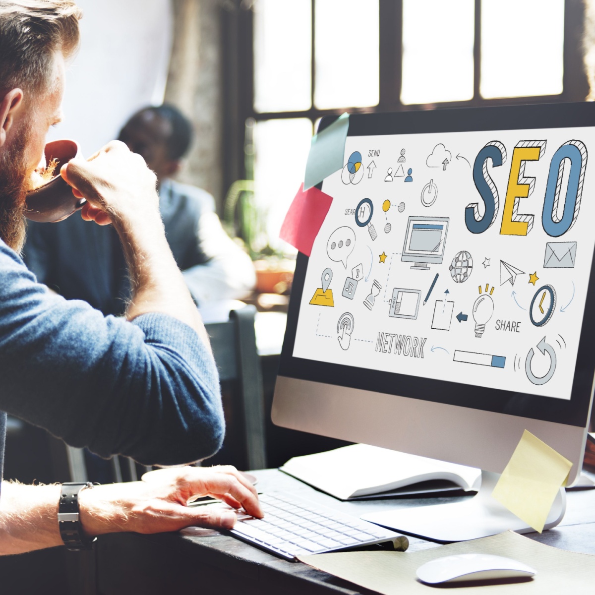 Developer integrates SEO to his custom Houston web design while drinking coffee.