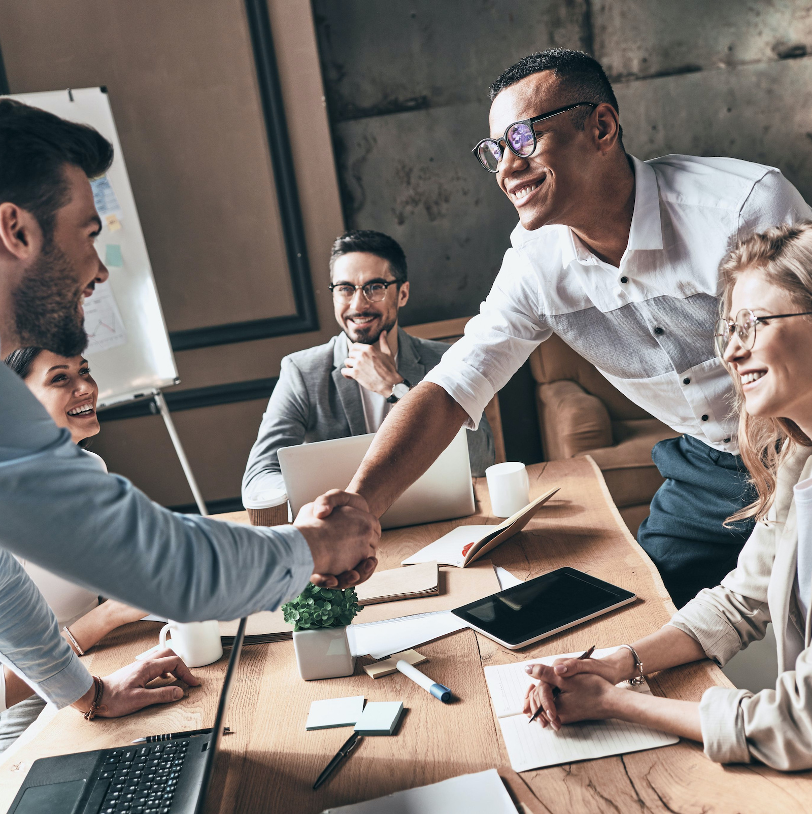 team closing a new deal with a marketing agency to expand their business